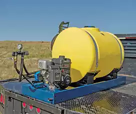 High-capacity yellow skid sprayer featuring a powerful engine and mounted on a truck bed for efficient spraying.