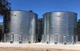 Two corrugated tanks side by side