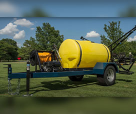 Turf sprayer trailer with a yellow tank and boom arms for spraying